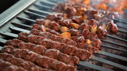 Arabic traditional food kufta and lamb brochette on the grill. traditional food.