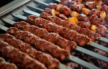 Arabic traditional food kufta and lamb brochette on the grill. traditional food.