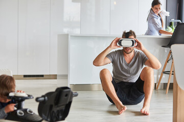 Man explores living room with VR glasses