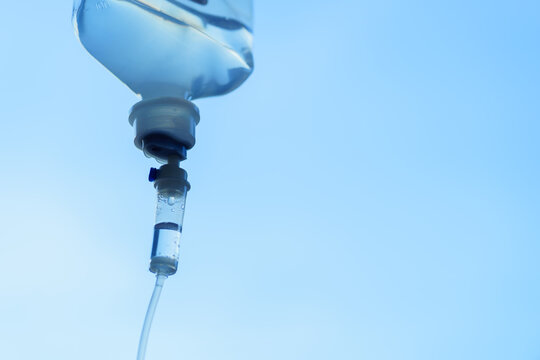 0.9% Normal saline solution (NSS) in the hospital. Close up drops of saline solution.