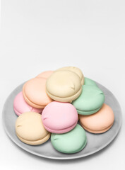 Colorful zephyr on a plate on white background