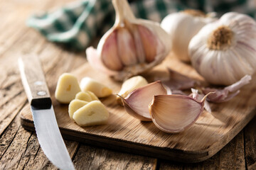 Garlic cloves on rustic wooden table	