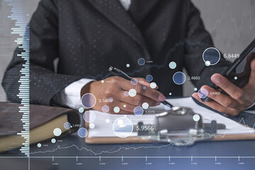 African American businesswoman in formal wear is signing the contract to invest money in stock market. Internet trading and wealth management. Checking the details of transaction at smart phone. Forex