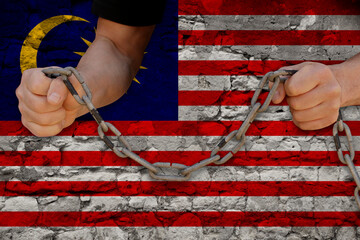 male hands breaking the iron chain, symbol of tyranny, protest against the background of the...