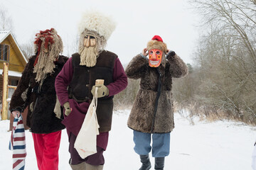 People in demon masks are caroling in a Russian village. folk holidays and customs in russia.