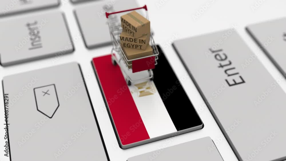 Poster cartons with made in egypt text and shopping cart on the computer keyboard. conceptual looping 3d an