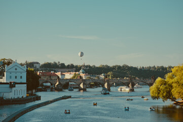 PRAGUE, CZECH REPUBLIC: Side view of the Charles Bridge, Catamarans and ships