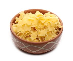 Pasta all'uovo pile in clay bowl isolated on white background