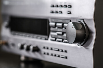 Fototapeta premium The audio amplifier panel. One large pen is in focus. In the background, you can see the handles with a smaller radius.