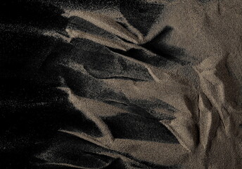 Beach, desert sand pile isolated on black background, top view