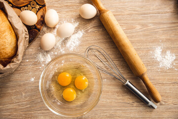 Baking background with eggs, bread and kitchen utensil