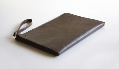 brown clutch bag isolated on white background.