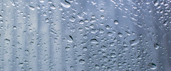Water drops on the window pane. Blurred background, gradient.