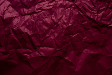
Dark red rumpled paper background 