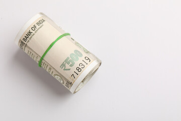 A stack of five hundred rupee notes (Indian currency) isolated on a white background.