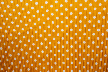 pleated yellow polka dot fabric