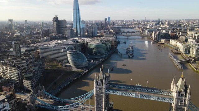 London Tower Bridge amazing Aerial footage, taken in January 2021 showing around the skyline of london business center the River Thames. United Kigdom