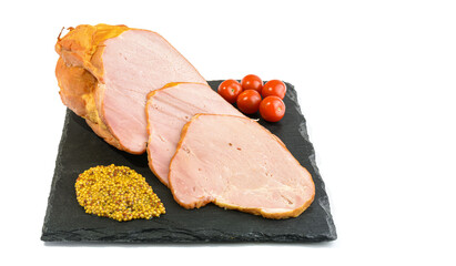 Sliced smoked pork loin with tomatoes and mustard seeds on a stone plate, isolated on a white background.