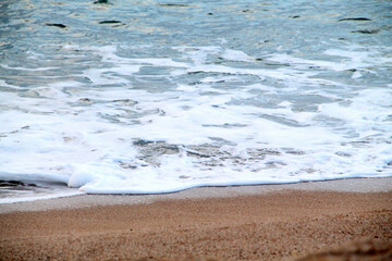 waves on the beach. Wave of the blue sea on the sand beach. summer