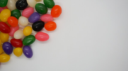 Jelly beans on a white background with copy space for a message.
