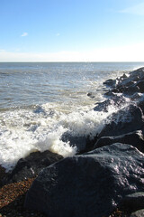Sea surf beating against the stone shore
