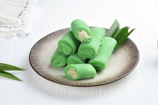 dadar gulung or ketayap is an traditional sweet snack ,popular in indonesia and malaysia .white background