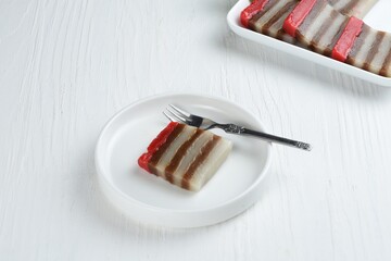 Kue lapis is Indonesian traditional colorful layered cake,made of soft rice flour,tapioca,sugar ,...