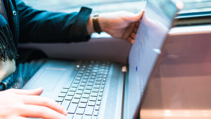 person typing on a laptop