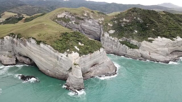 RISING AERIAL of New Zealands South Island rugged coastline