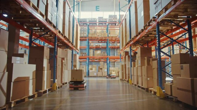 Future Technology 3D Concept: Automated Modern Retail Warehouse AGV Robots Transporting Cardboard Boxes in Distribution Logistics Center. Automated Guided Vehicles Delivering Goods, Products, Packages