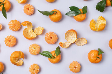 Fresh Ripe Tangerine and Peel on Blue Background Top View Horizontal Toned