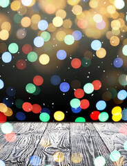 Empty wooden surface and blurred Christmas lights on background, bokeh effect