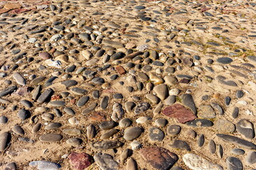 Stone-paved road close-up in summer