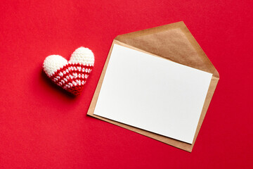 Valentines day card mockup with envelope and knitted heart
