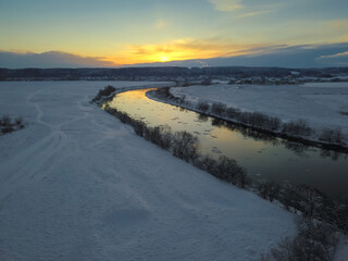 Beautiful winter landscape, sunset over the Dnipro river, view from the drone