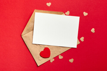 Valentines day card mockup with envelope and small paper hearts on red