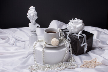An aristocratic breakfast. A Cup of coffee in the style of gypsum figure
