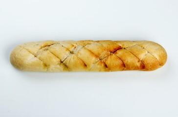Crunchy sliced french bread stuffed by herbs, butter and garlic. Isolated on white background....
