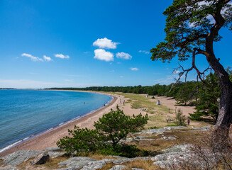 Sunny sand beach at seaside of Hanko town in southmost part of Finland