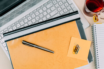 Work Place composition with laptop, folder, notebook and supplies offices on Desk. Top View