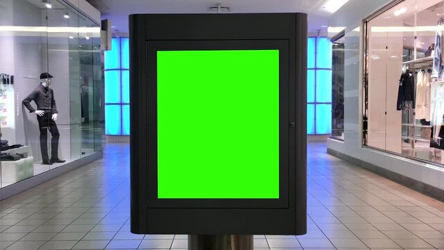 Green billboard for your ad inside the shopping mall with 4k resolution.