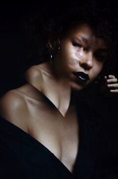 African girl photo studio black background double exposure.