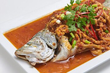Crispy fried fish topped with delicious dipping sauce, a popular dish.