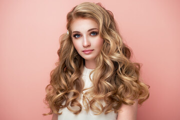 Portrait of young beautiful girl with blonde wavy hair. Fashion photo Hairstyle. Make up. Vogue Style.