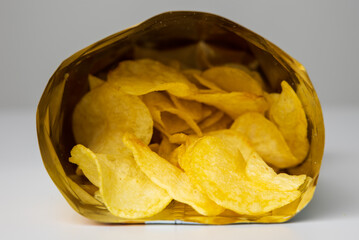 Crispy Potato chips snacks in bag package. Fast food or junk food snacks unhealthy concept.