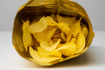 Crispy Potato chips snacks in bag package. Fast food or junk food snacks unhealthy concept.