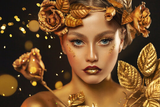 Fantasy portrait closeup woman with golden skin, lips, body. Girl in glamour wreath gold roses, accessories jewellery, jewelry. Beautiful face, steel glitter makeup. Elf fairy princess. Fashion model.