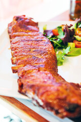 Grilled steak - Grilled meat, ribs on the plate with hot sauce