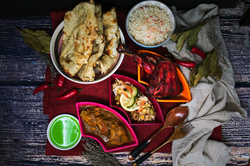 Traditional Indian food chicken tandoori and Tikka with garlic naan