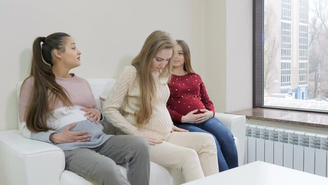 Pregnant girls waiting doctor in the waiting room